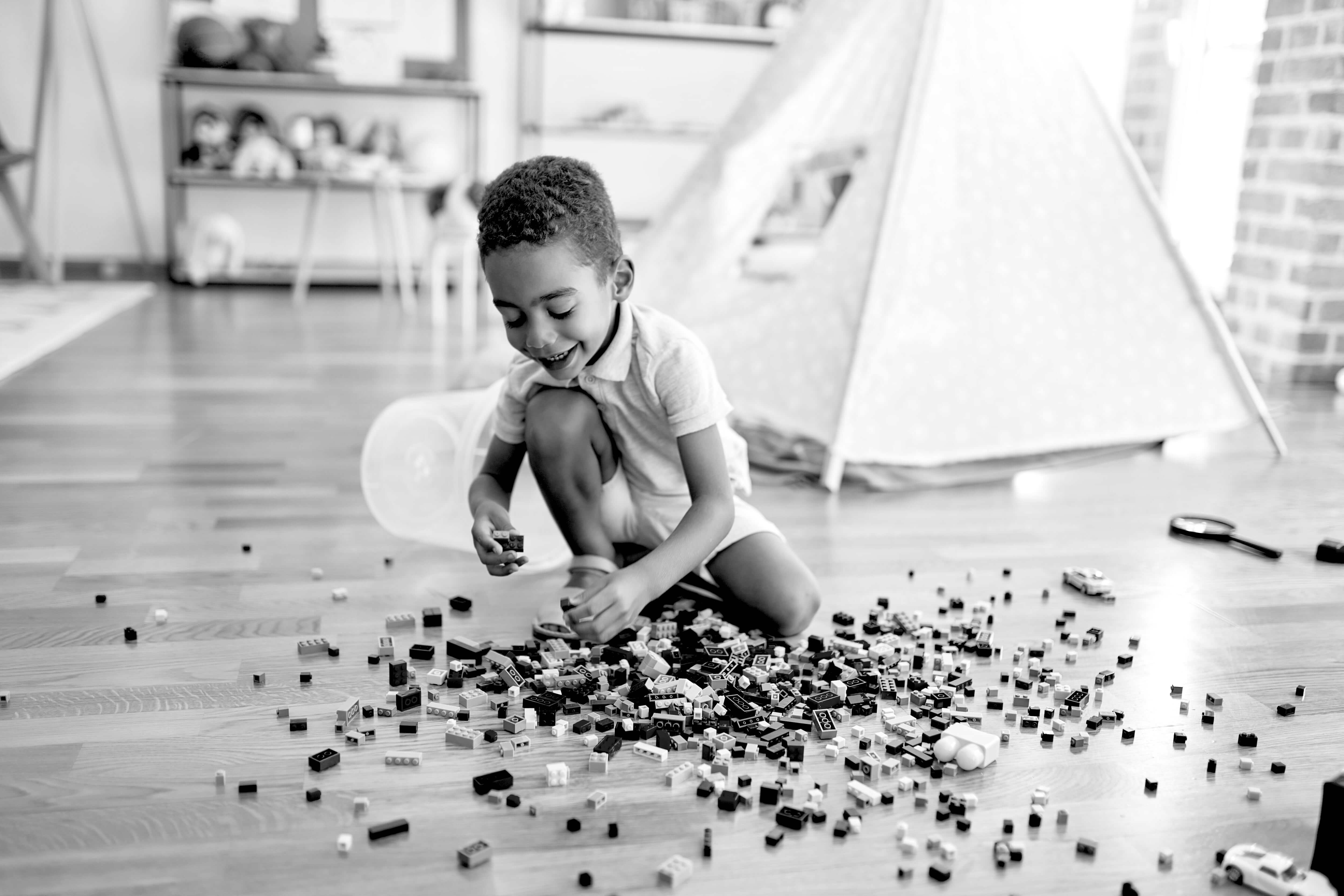 boy playing with blocks on the floor
